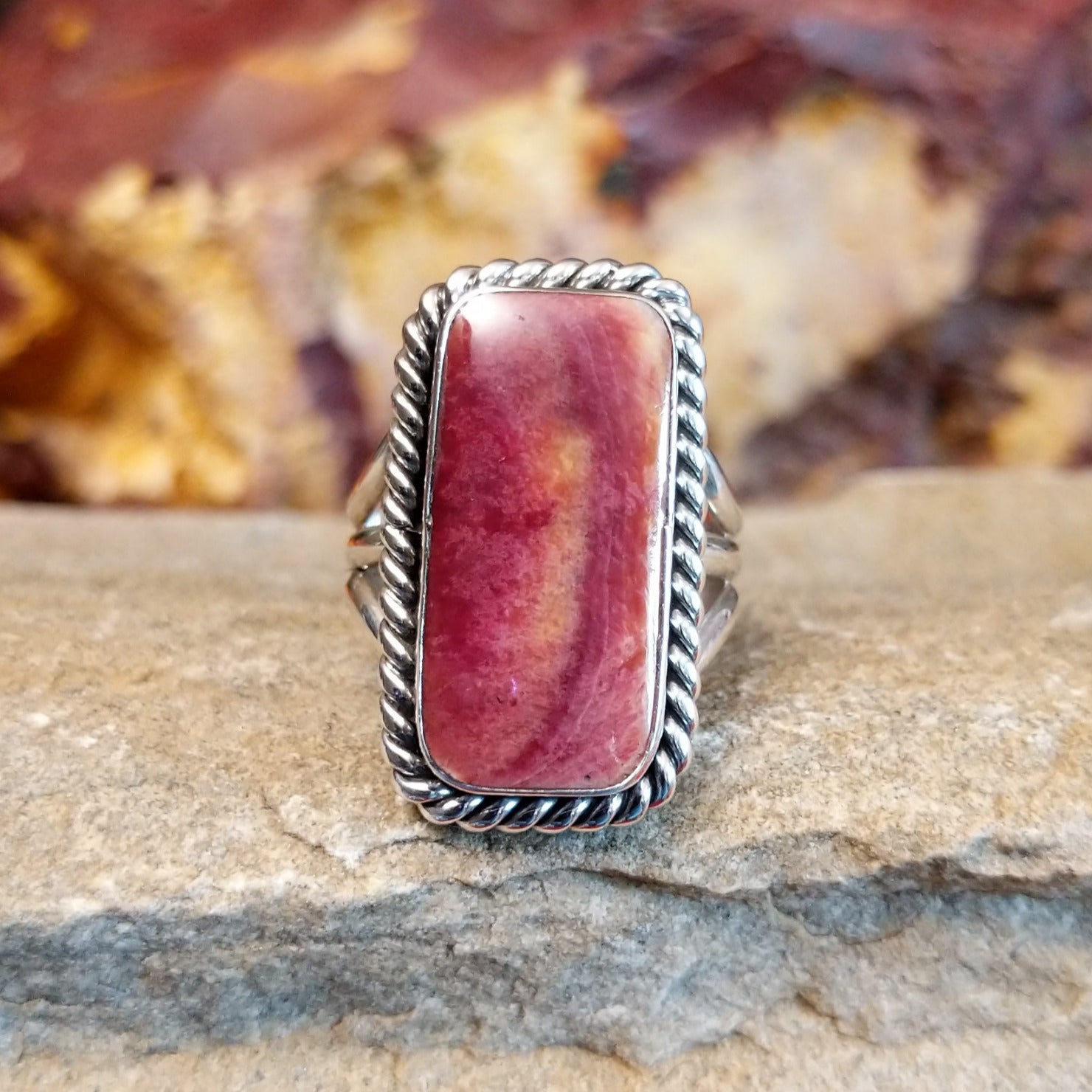 Rectangular purple spiny oyster shell set in a twisted rope bezel with a layered sterling silver band.