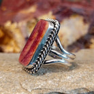 Rectangular purple spiny oyster shell set in a twisted rope bezel with a layered sterling silver band.