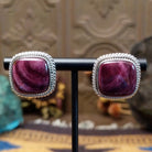 Sterling silver stud earrings featuring purple spiny oyster shell stones with twisted rope detailing.