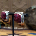Sterling silver stud earrings featuring purple spiny oyster shell stones with twisted rope detailing.