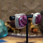 Sterling silver stud earrings featuring purple spiny oyster shell stones with twisted rope detailing.