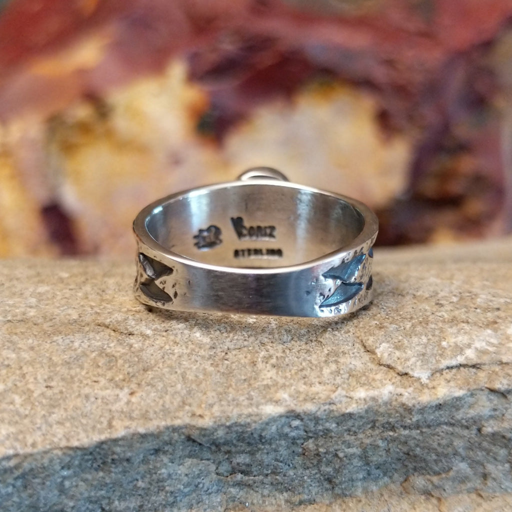 The band with intricate stamp work and semi-polished finish.