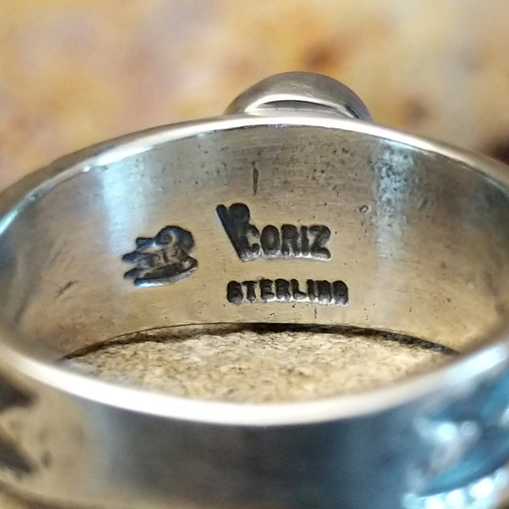 The artisan's stamp is found on the underside of the band.