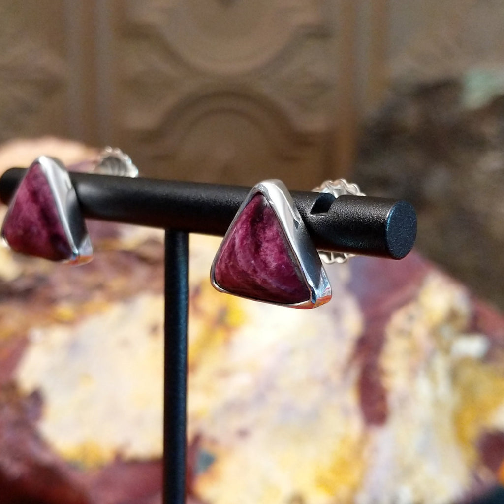 Triangular purple spiny oyster shell earrings set in dainty sterling silver frames.