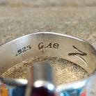 The stamps are found on the inside of the ring.