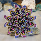 Sterling silver sun necklace set with rainbow colored Austrian crystal.
