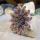 Sterling silver sun necklace set with rainbow colored Austrian crystal.