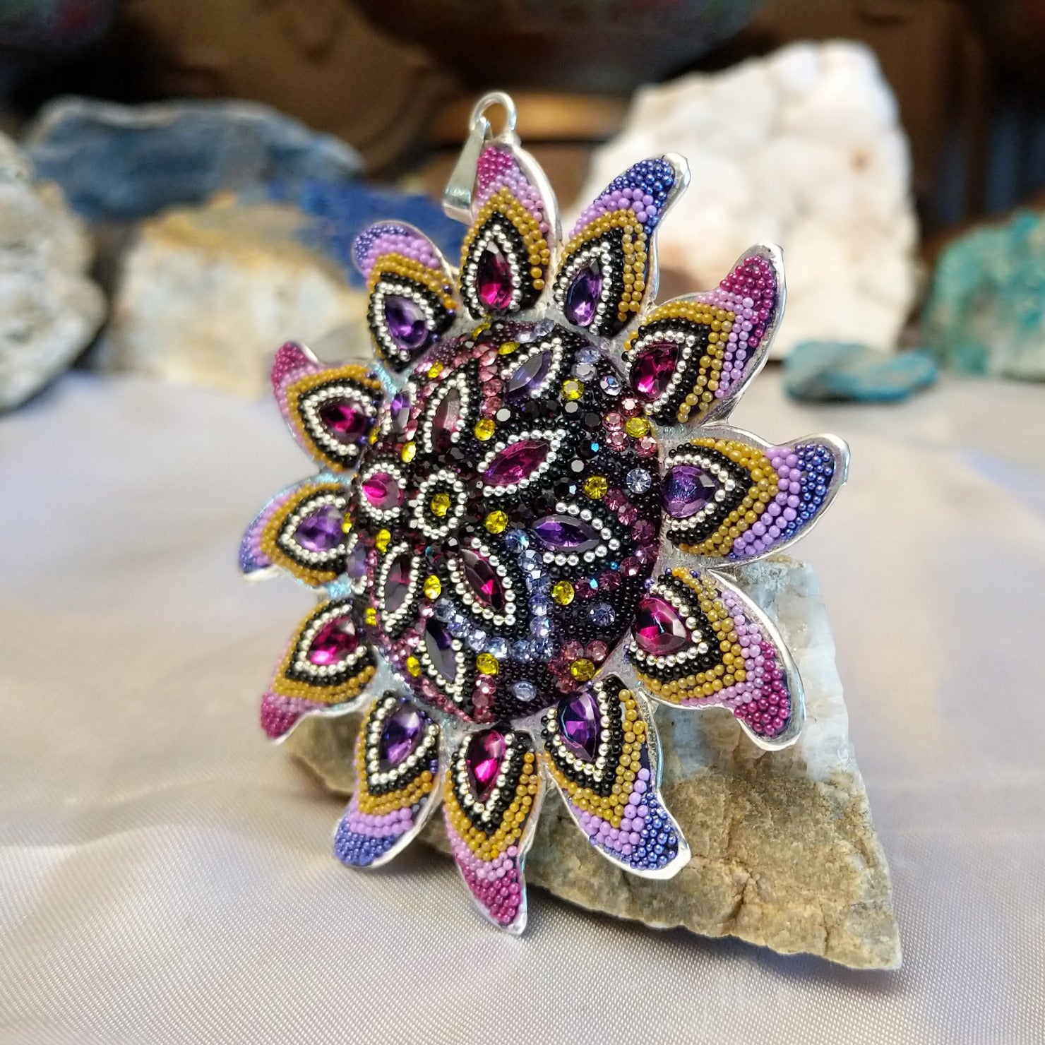 Sterling silver sun necklace set with rainbow colored Austrian crystal.