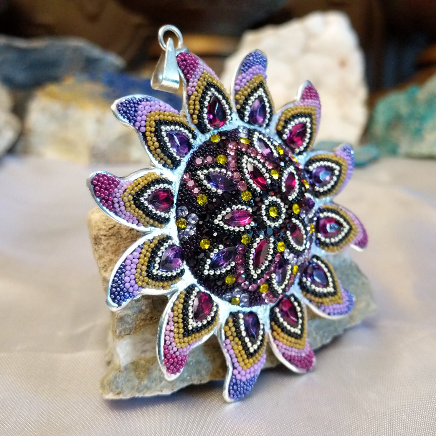 Sterling silver sun necklace set with rainbow colored Austrian crystal.