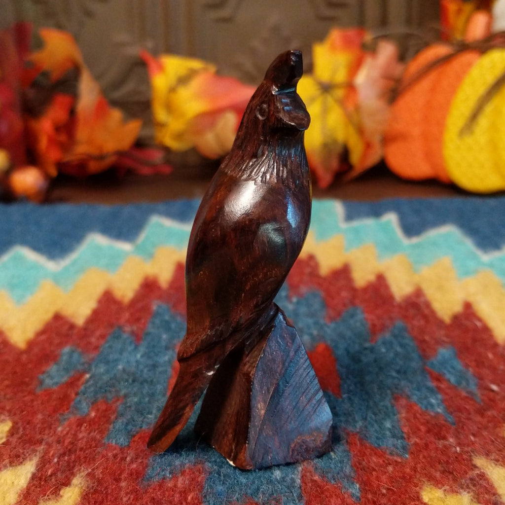 Ironwood carved into a detailed quail figurine.