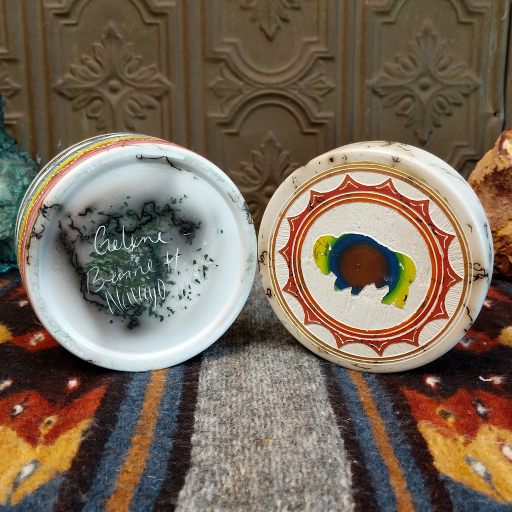 Gelene Bennet's signature is etched on the bottom of the jar along with the buffalo motif on the top of the lid.