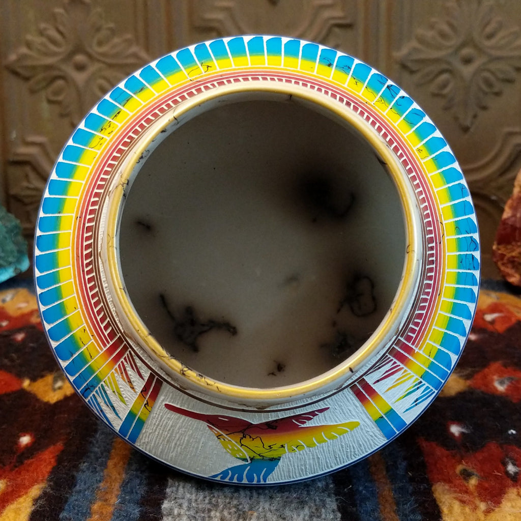 Interior of the pot revealing smooth white clay surface and horsehair fired into the pot.