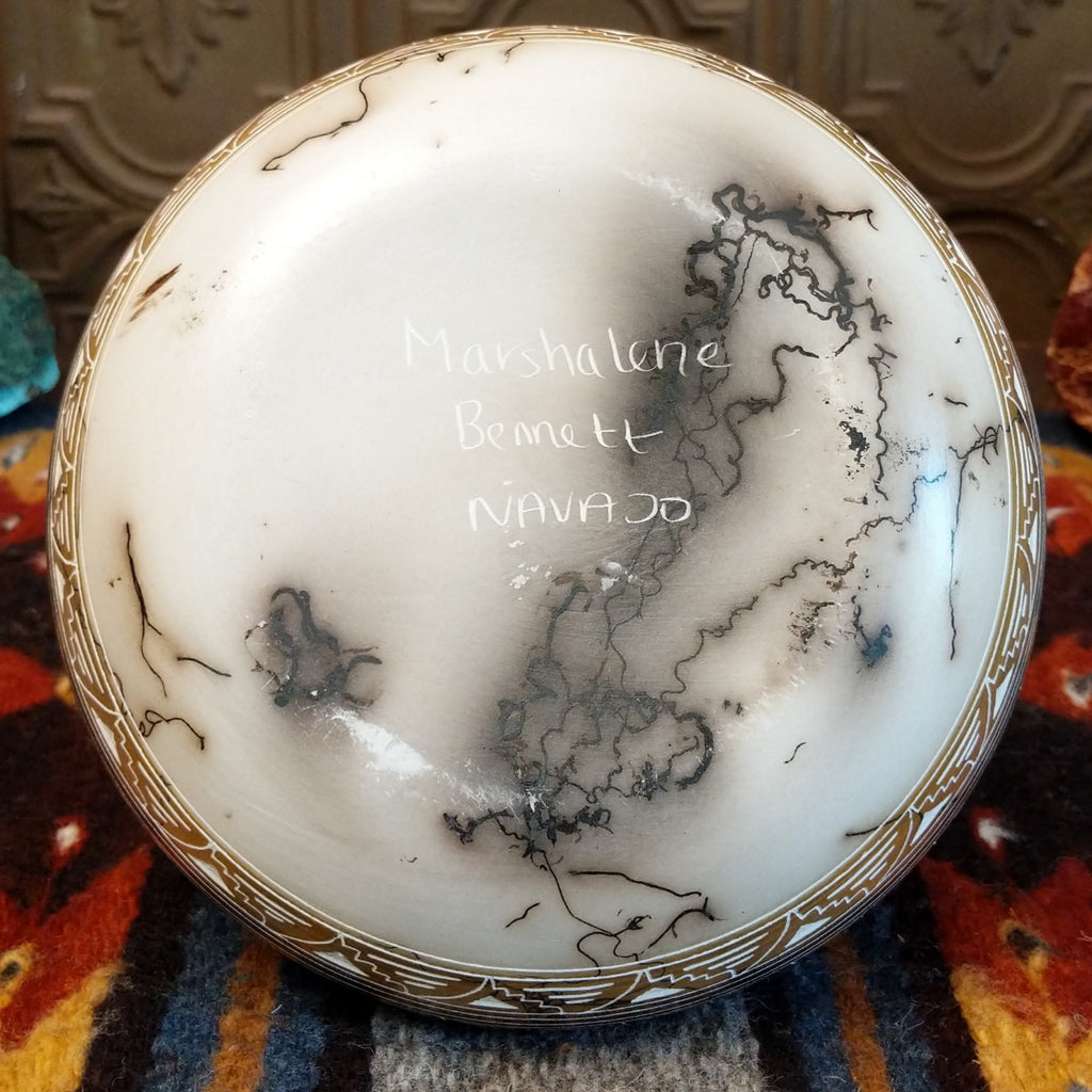 Marshalene Bennett’s signature etched on the pottery base.