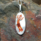 Handcrafted sterling silver Rainbow Kachina pendant by Harlan & Monica Coonsis, featuring vibrant Zuni multistone inlay.
