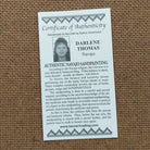 Close up of the Certificate of Authenticity and Artist information. 