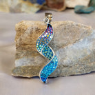 Sterling silver spiral pendant with Austrian crystal.