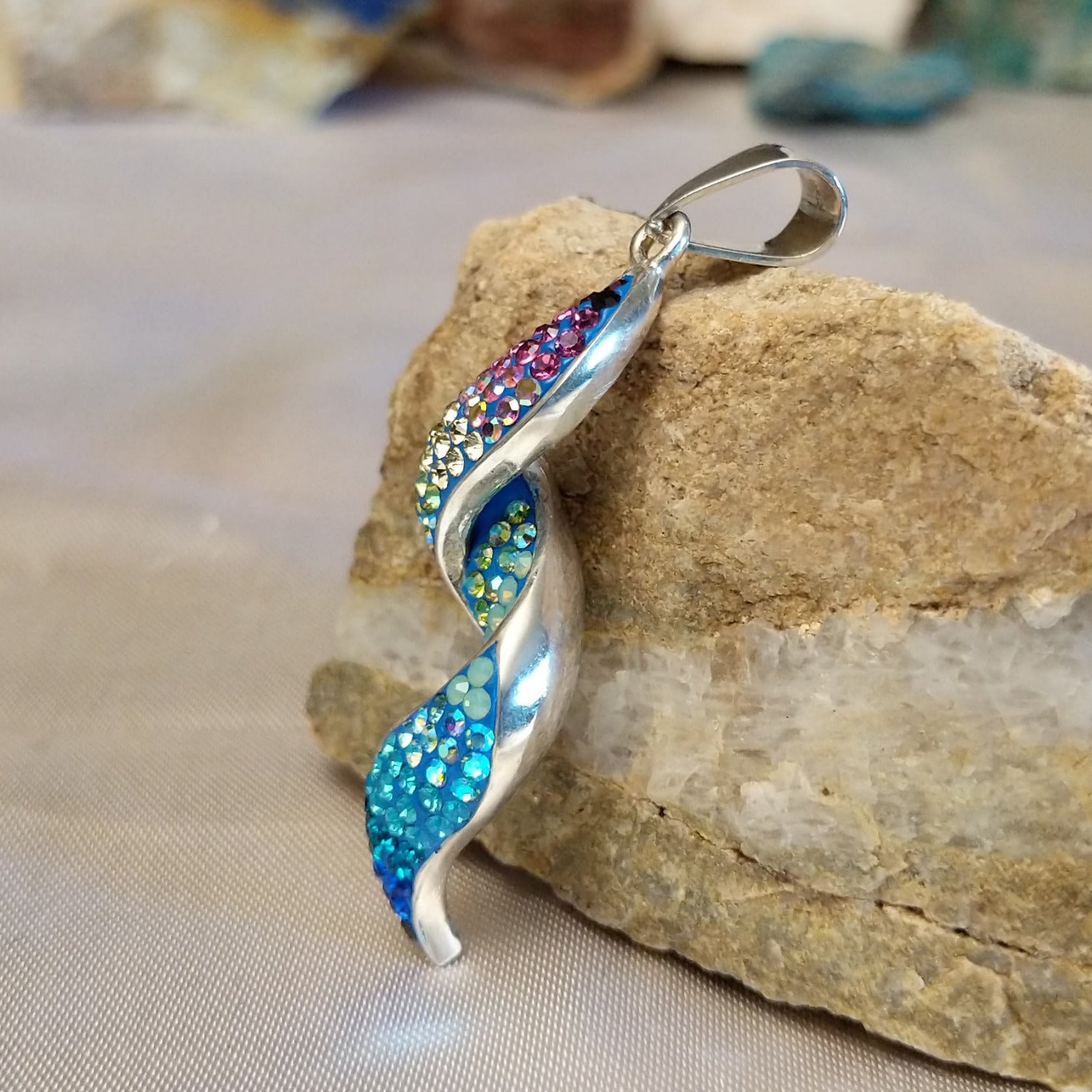 Sterling silver spiral pendant with Austrian crystal.