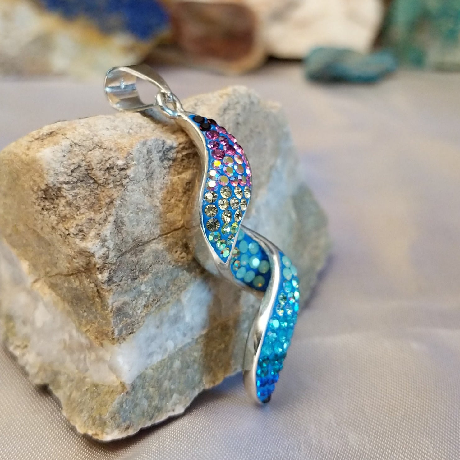 Sterling silver spiral pendant with Austrian crystal.