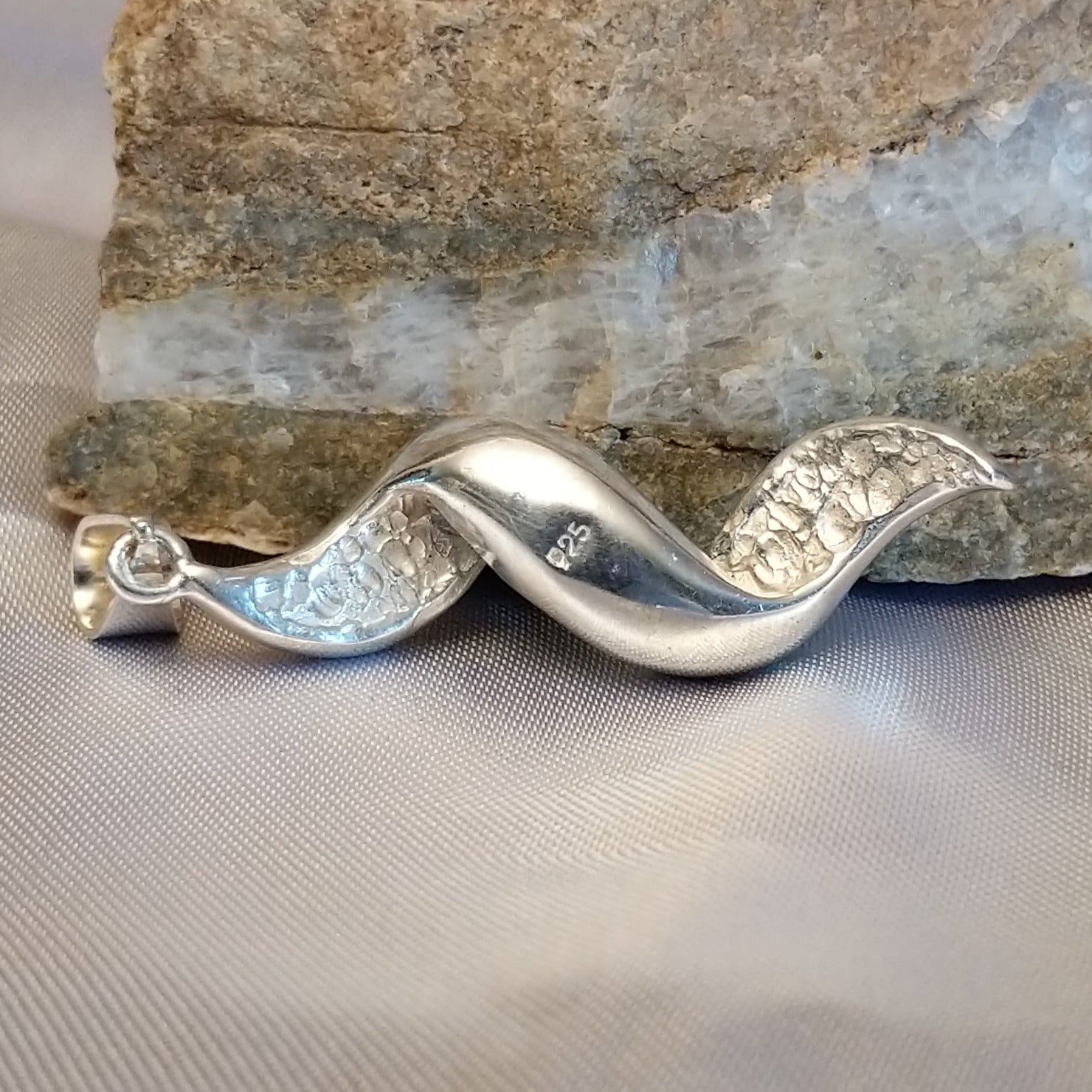 Sterling silver spiral pendant with Austrian crystal.