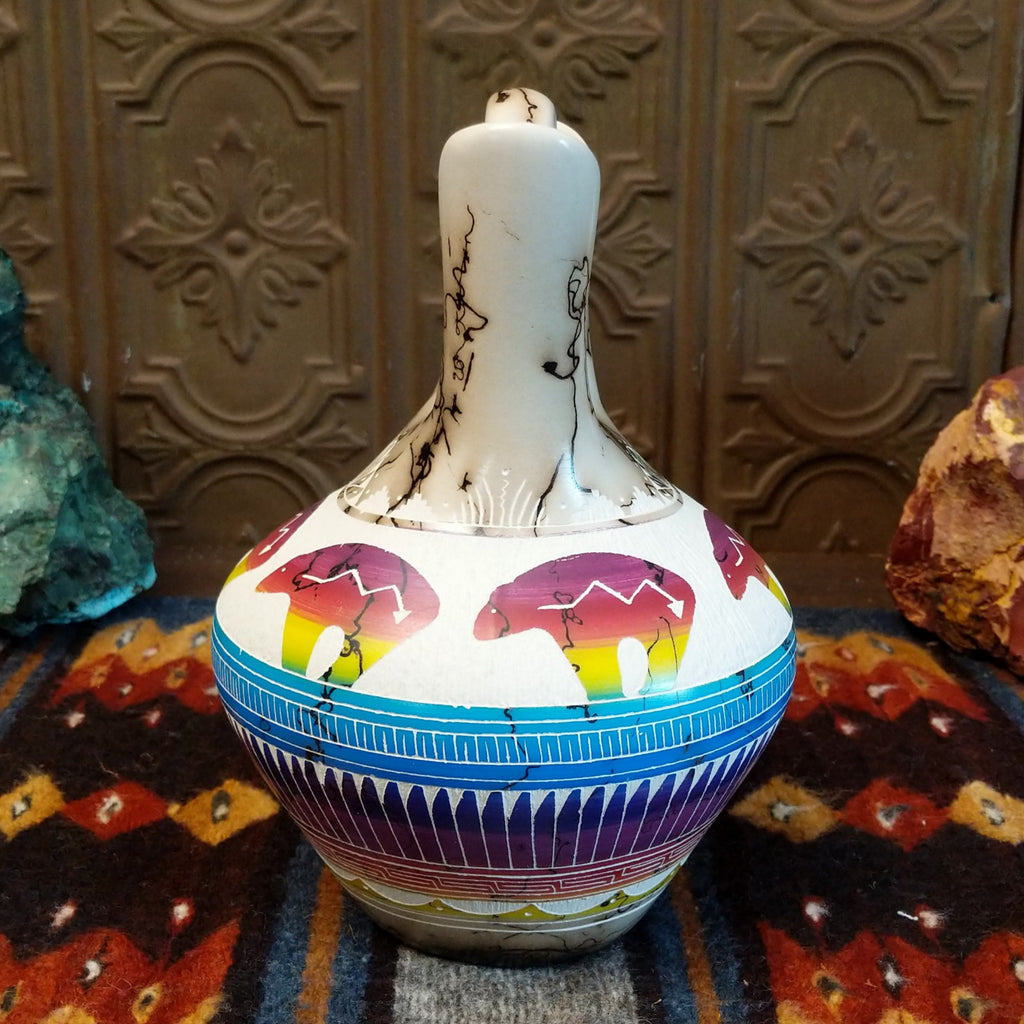 Wedding vase showing spirit bear motifs, rainbow layers, and horsehair texture on white clay.