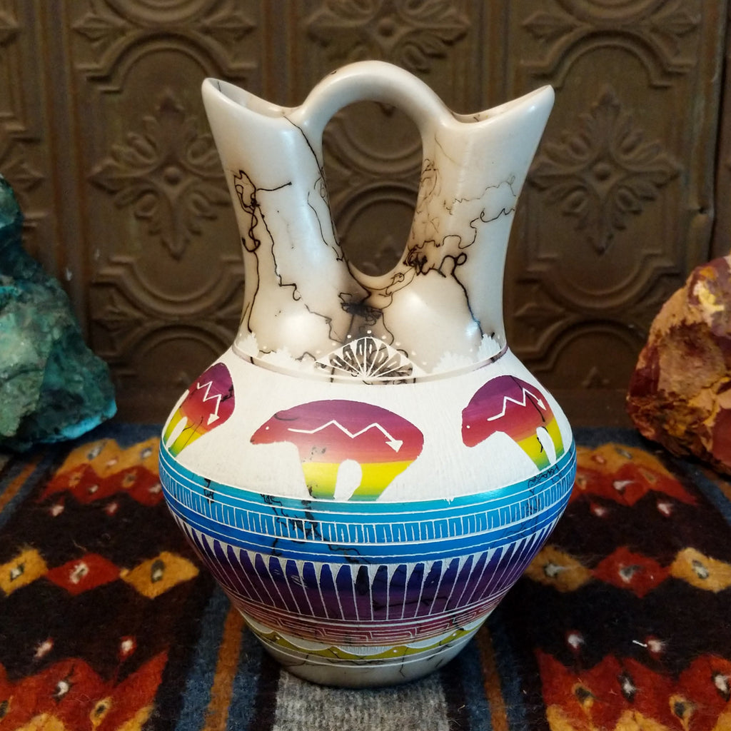 Wedding vase showing spirit bear motifs, rainbow layers, and horsehair texture on white clay.