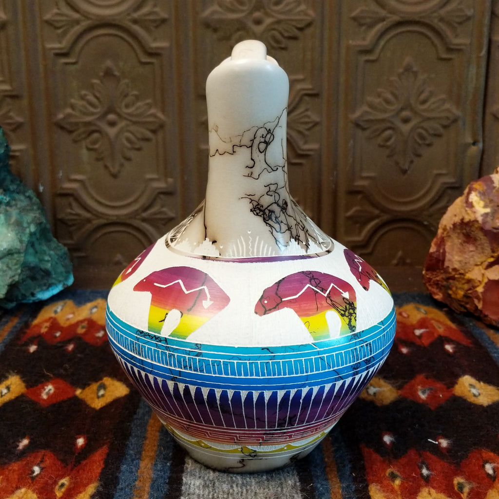 Wedding vase showing spirit bear motifs, rainbow layers, and horsehair texture on white clay.