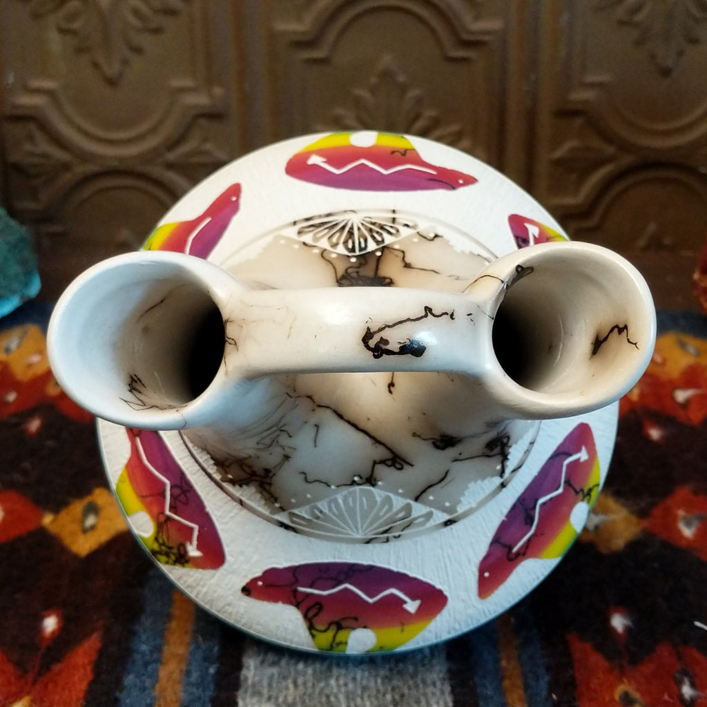 Interior of the wedding vase revealing smooth white clay surface and dual spouts.
