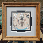 Framed Navajo sand painting of a Rainbow Yei with symbolic motifs.