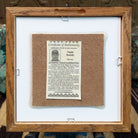 Backside of the Rainbow Yei sand painting, showing the Certificate of Authenticity and Artist information. 