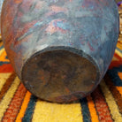 Round raku pottery vase by Roger Calhoun with a flared rim, raised geometric bands, and a metallic copper, bronze, and smoky brown finish.