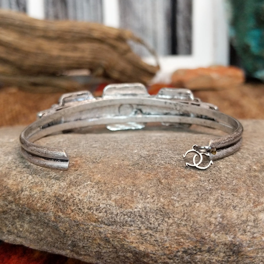 Cowgirl Confetti logo in the form of a charm at the tail of the bracelet.