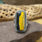 Rectangle bumblebee jasper ring by Terry Wood, featuring a vibrant rectangular bumblebee jasper stone with natural yellow, orange, black, and gray patterns set in a handcrafted sterling silver band.