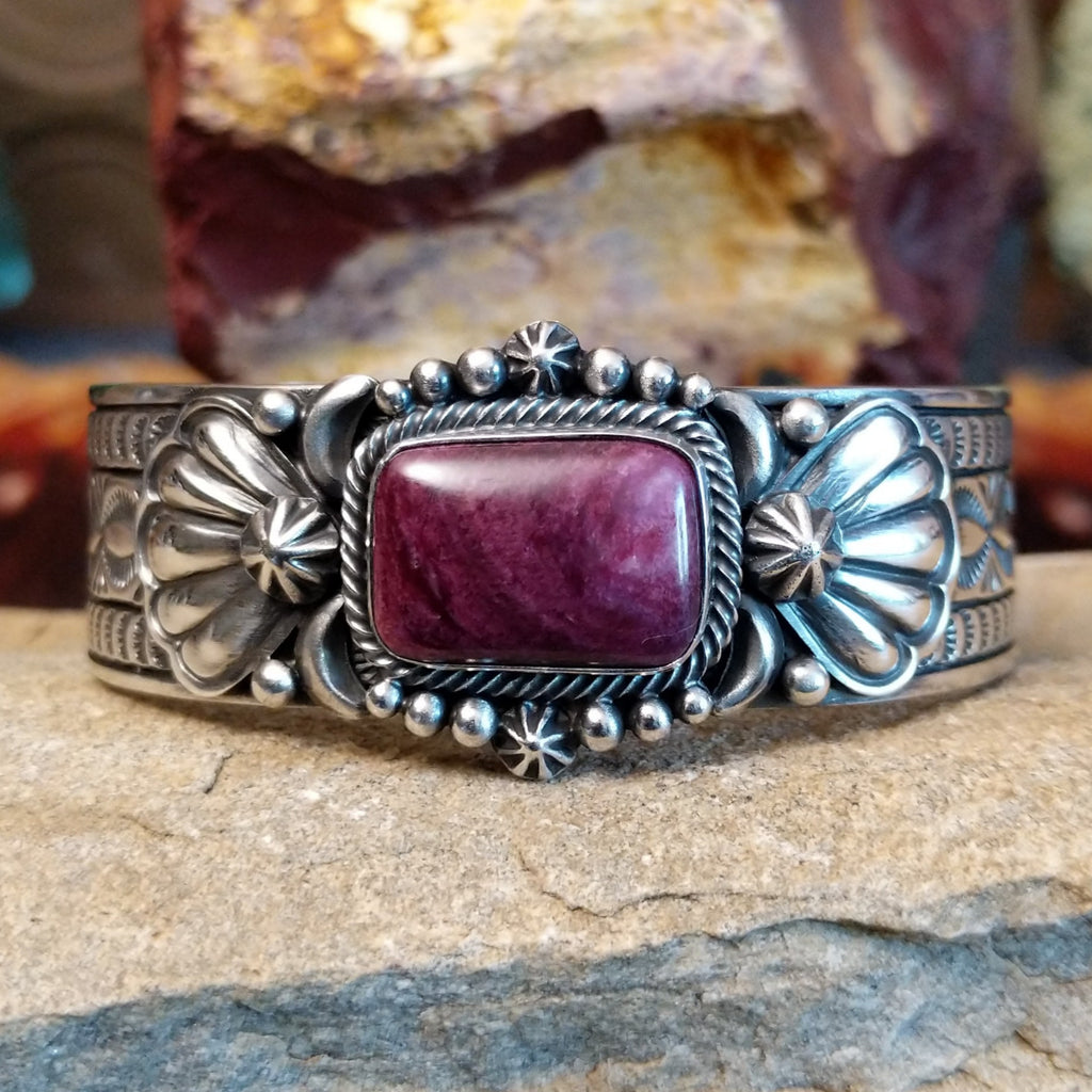 A rectangular purple spiny oyster shell cuff set in detailed sterling silver.