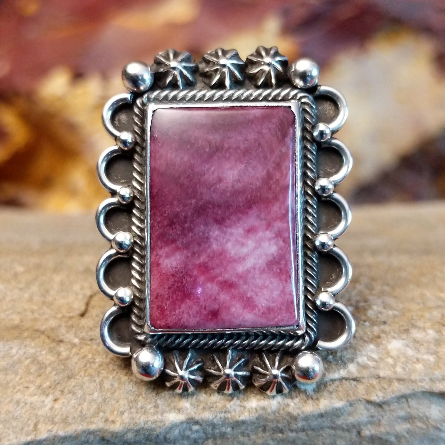 Rectangular purple spiny oyster shell framed by twisted rope, scalloped edges, dot work, and stars.