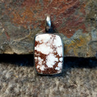Rectangular wild horse stone set in a sterling silver bezel.