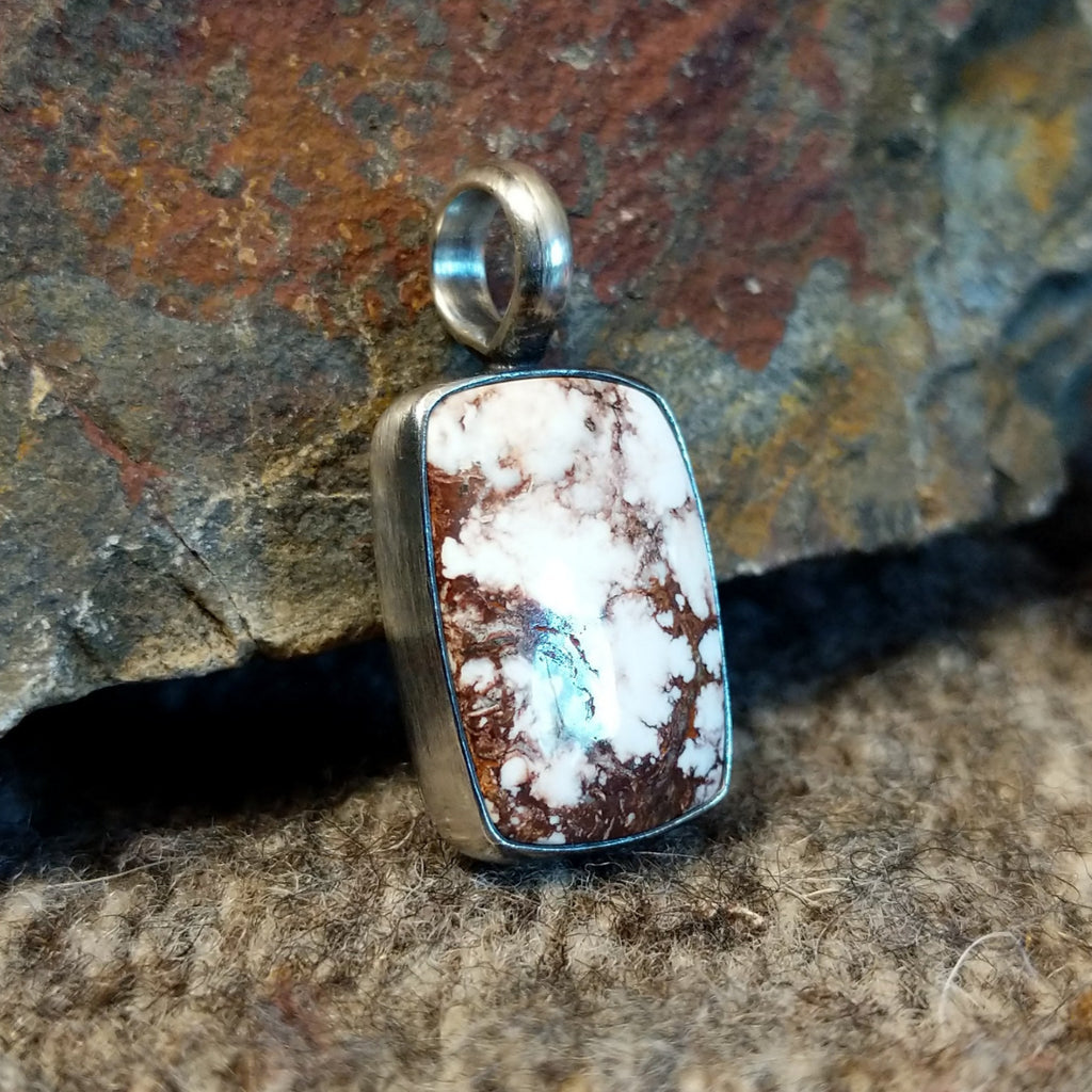 Rectangular wild horse stone set in a sterling silver bezel.
