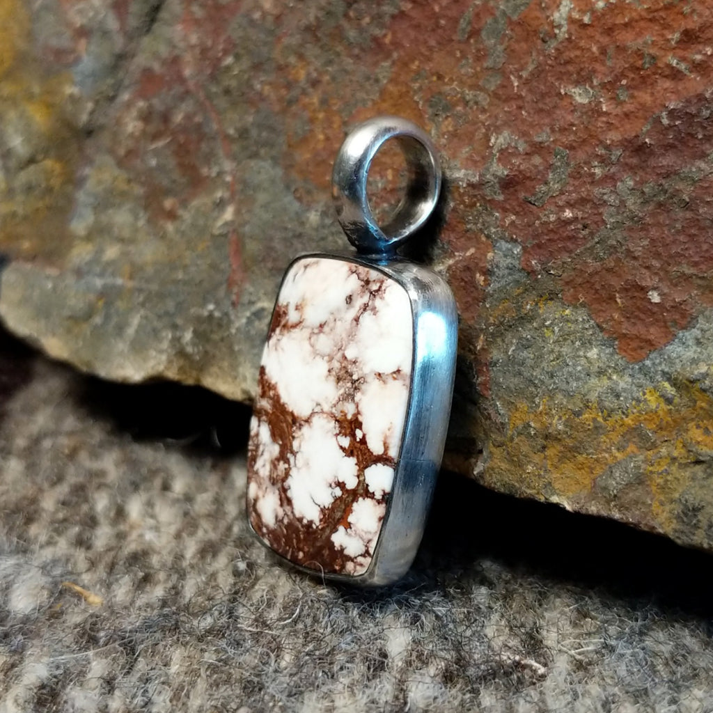 Rectangular wild horse stone set in a sterling silver bezel.