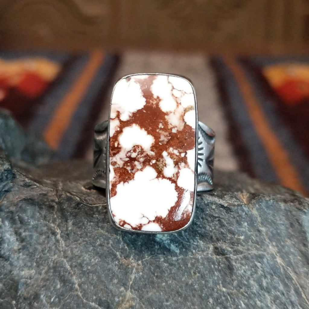 A rectangular wild horse stone set in a simple silver bezel.
