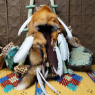 Red Fox Cradleboard artifact reproduction by Lyrissa Lee Chavez-Nelson featuring a red fox pelt, leather backing, and white feather accents.