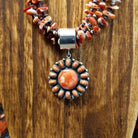 Red spiny oyster shell set on the sterling silver pendant.