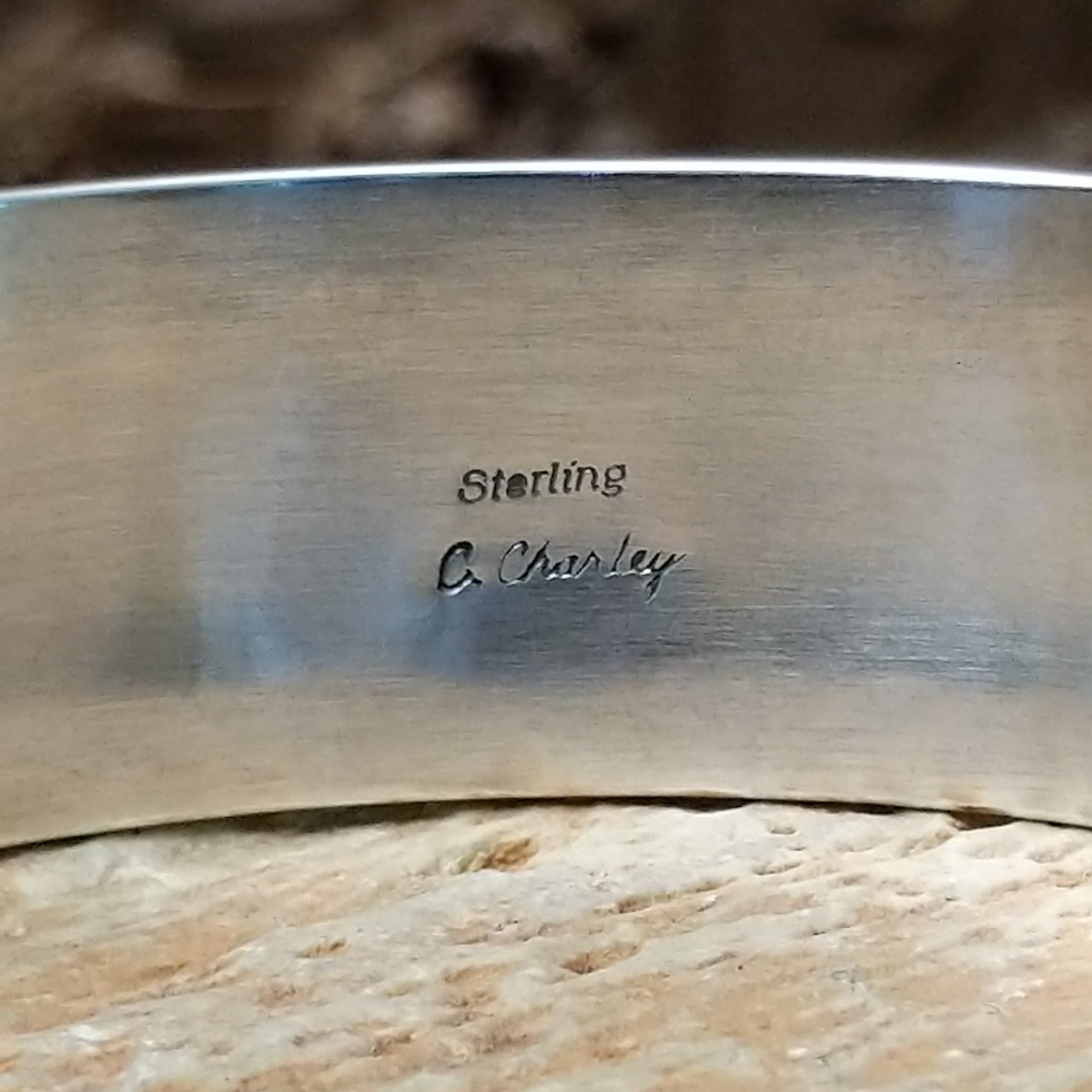 Close-up of the artisan's stamped signature.