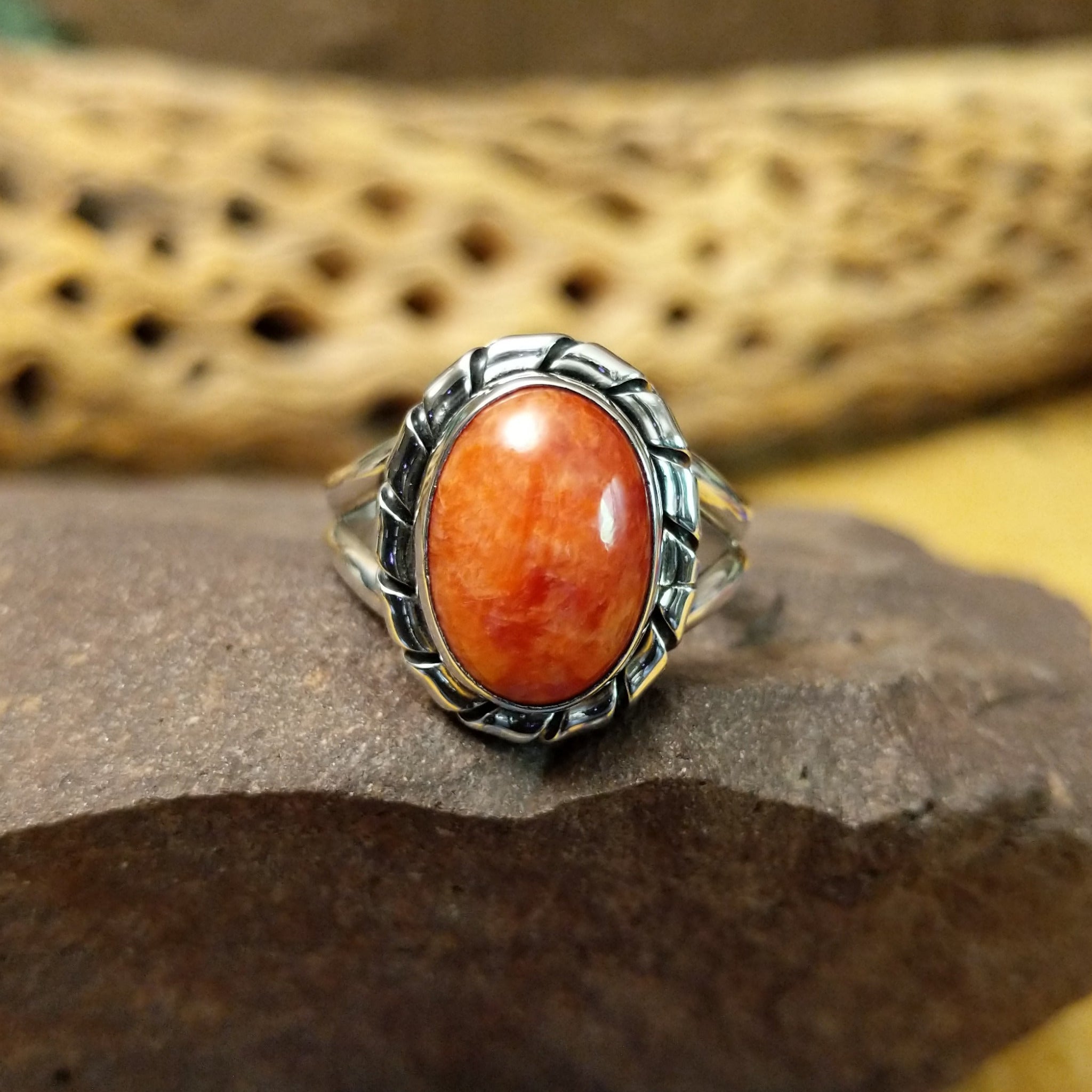 Red spiny oyster shell ring by Terry Wood, featuring a vibrant red spiny oyster shell set in a handcrafted sterling silver band with traditional Southwestern-inspired metalwork.
