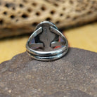Red spiny oyster shell ring by Terry Wood, featuring a vibrant red spiny oyster shell set in a handcrafted sterling silver band with traditional Southwestern-inspired metalwork.  Underside view.
