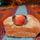Red Spiny Oyster Shell Ring by Terry Wood with geometric silver detailing.