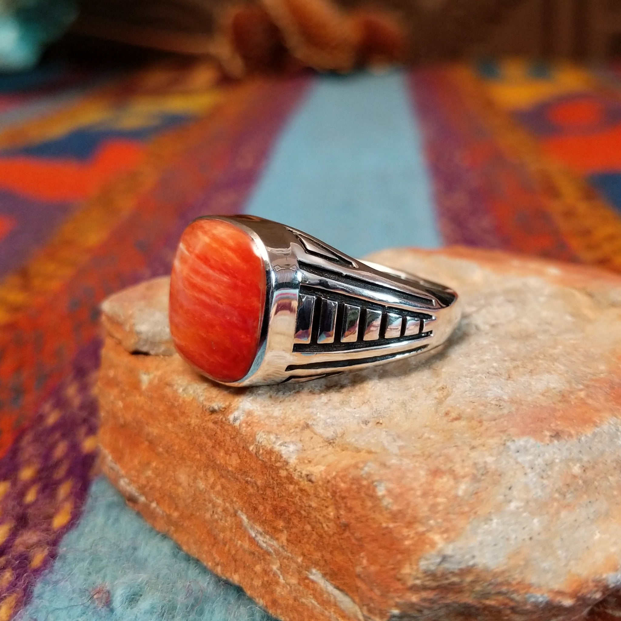 Red Spiny Oyster Shell Ring by Terry Wood with geometric silver detailing.