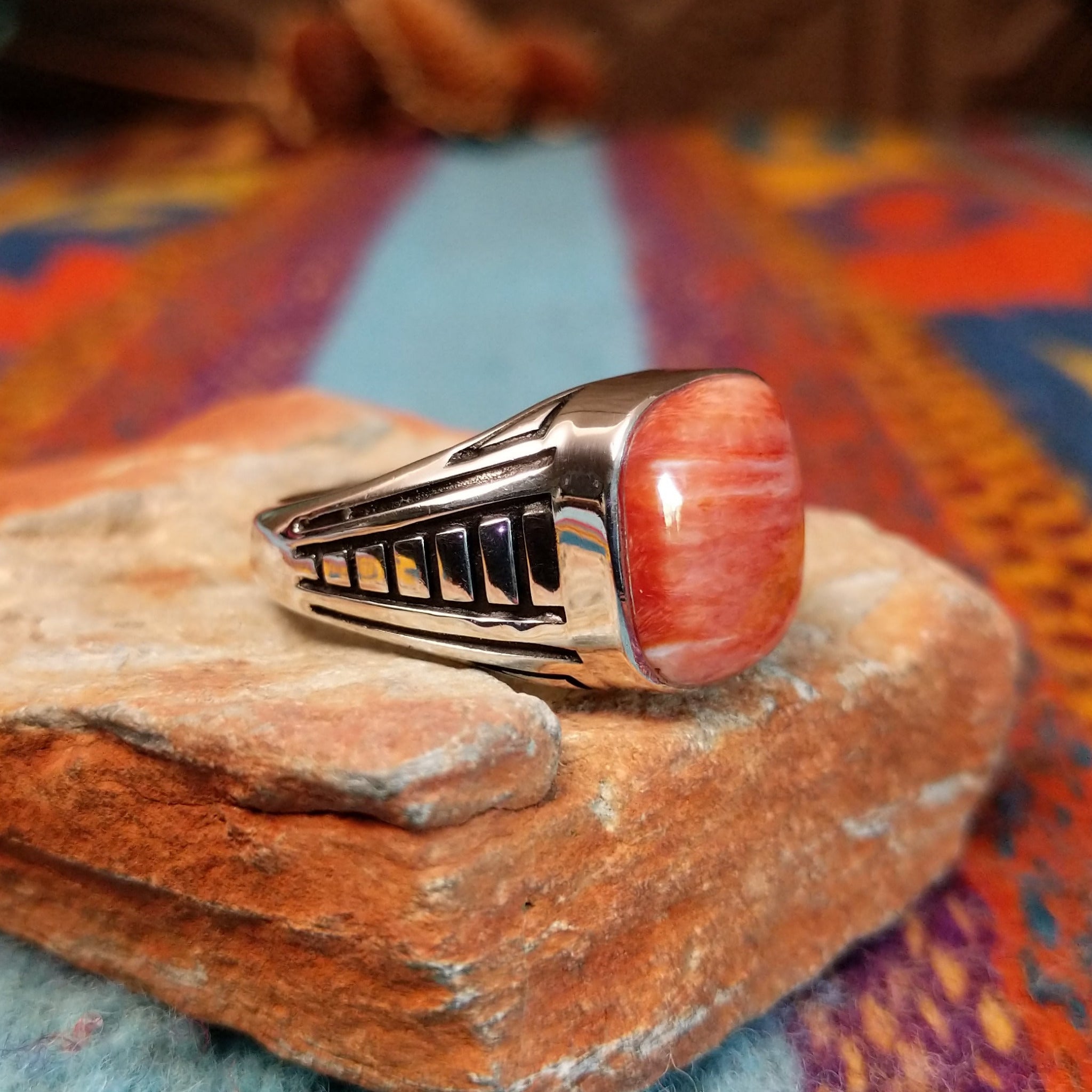 Red Spiny Oyster Shell Ring by Terry Wood with geometric silver detailing.