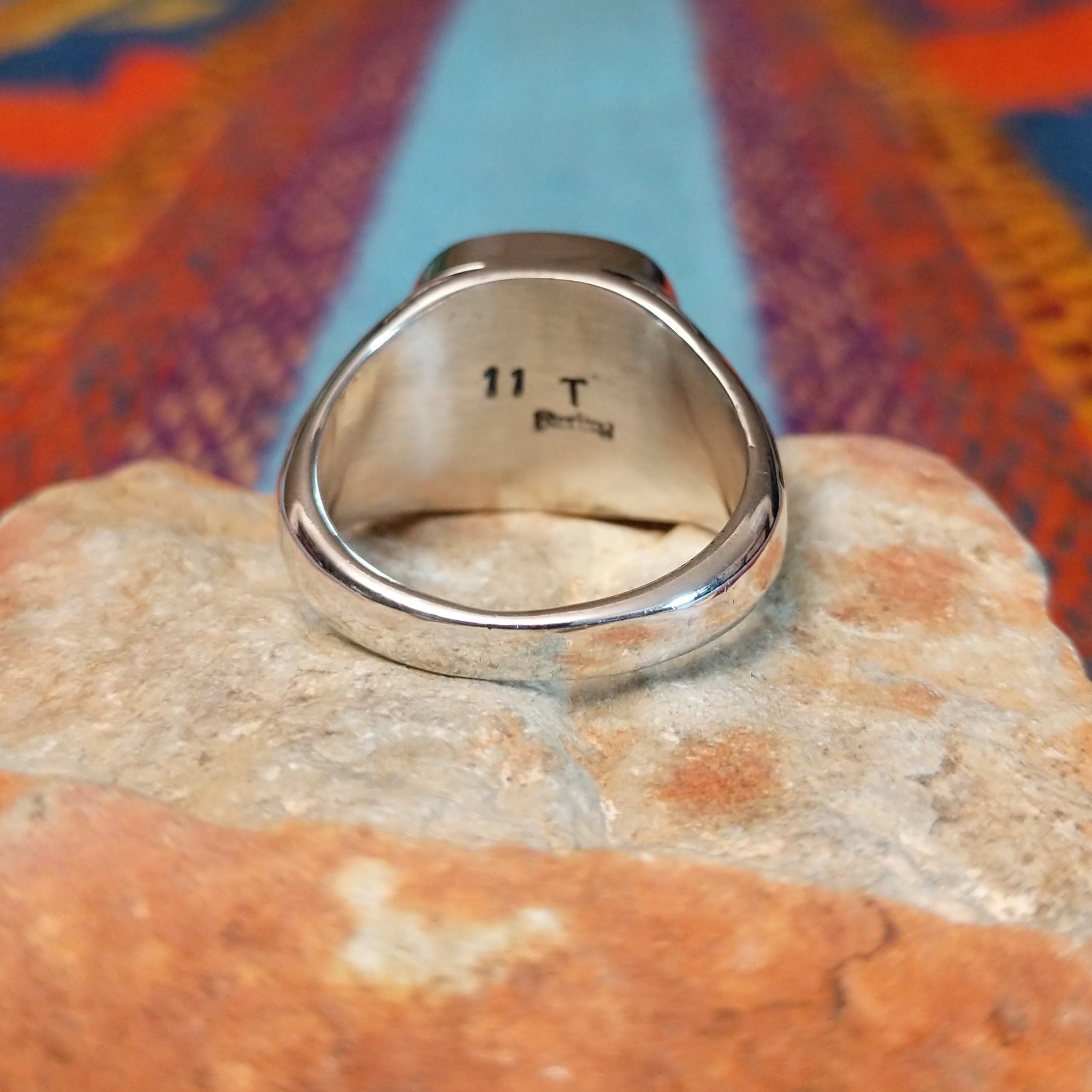 Red Spiny Oyster Shell Ring by Terry Wood with geometric silver detailing.