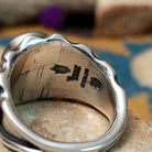 Sterling silver Red Spiny Oyster Shell ring by Raymond Coriz with an oval red and orange gemstone in a sunburst design; artisan and Sterling Silver stamp.