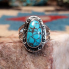 Sterling silver ring with Redskin turquoise set in oval bezel.