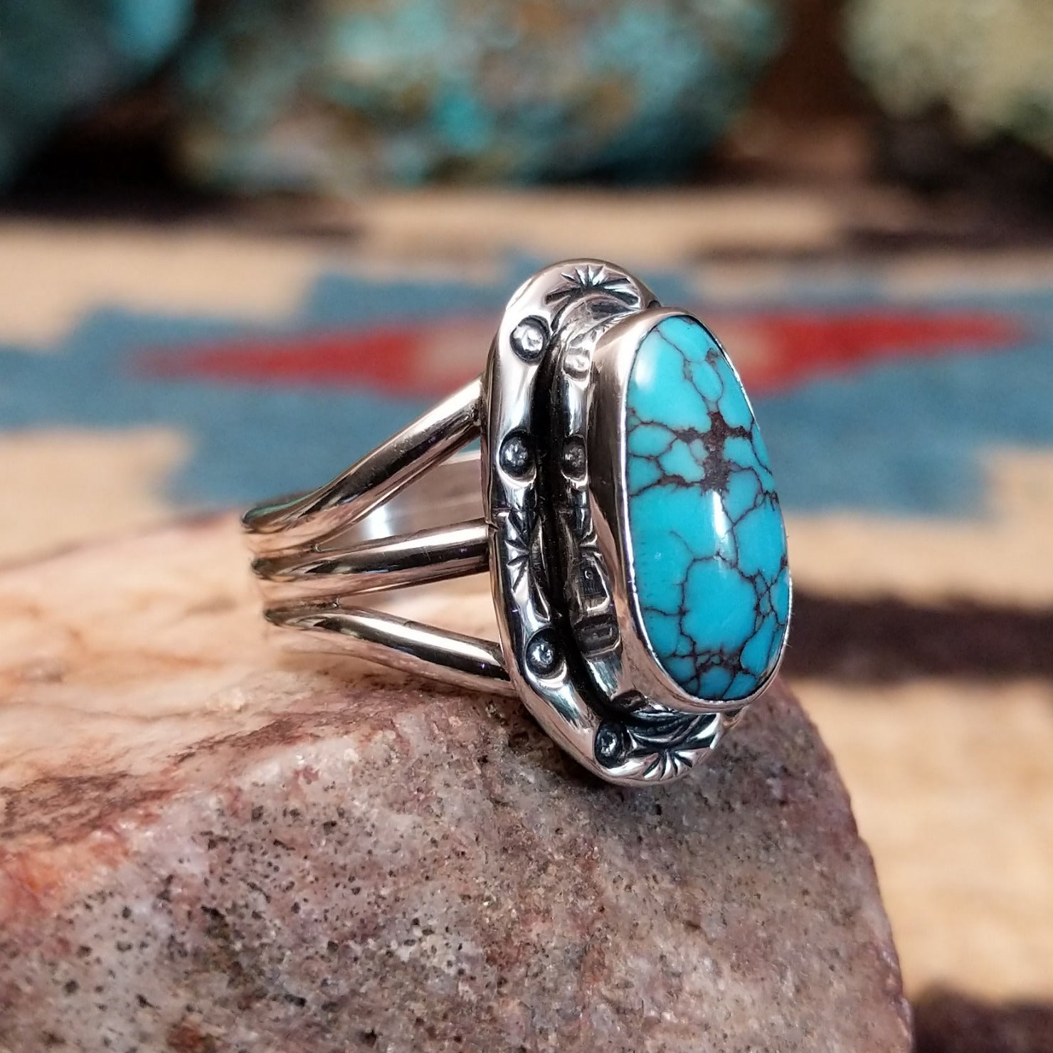 Sterling silver ring with Redskin turquoise set in oval bezel.